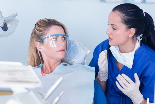 dentist explains to patient