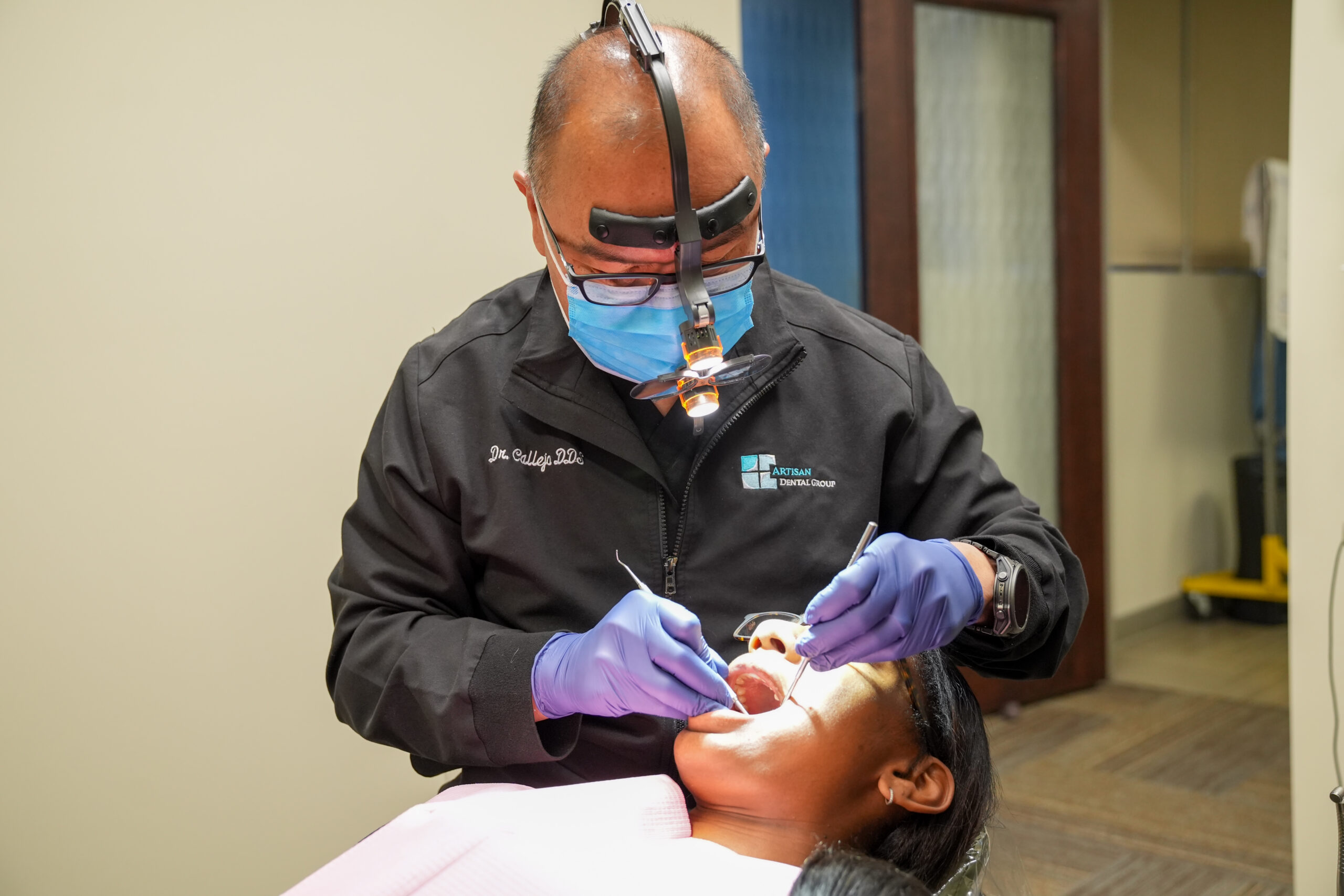 Dr. Callejo providing dental treatment for a patient